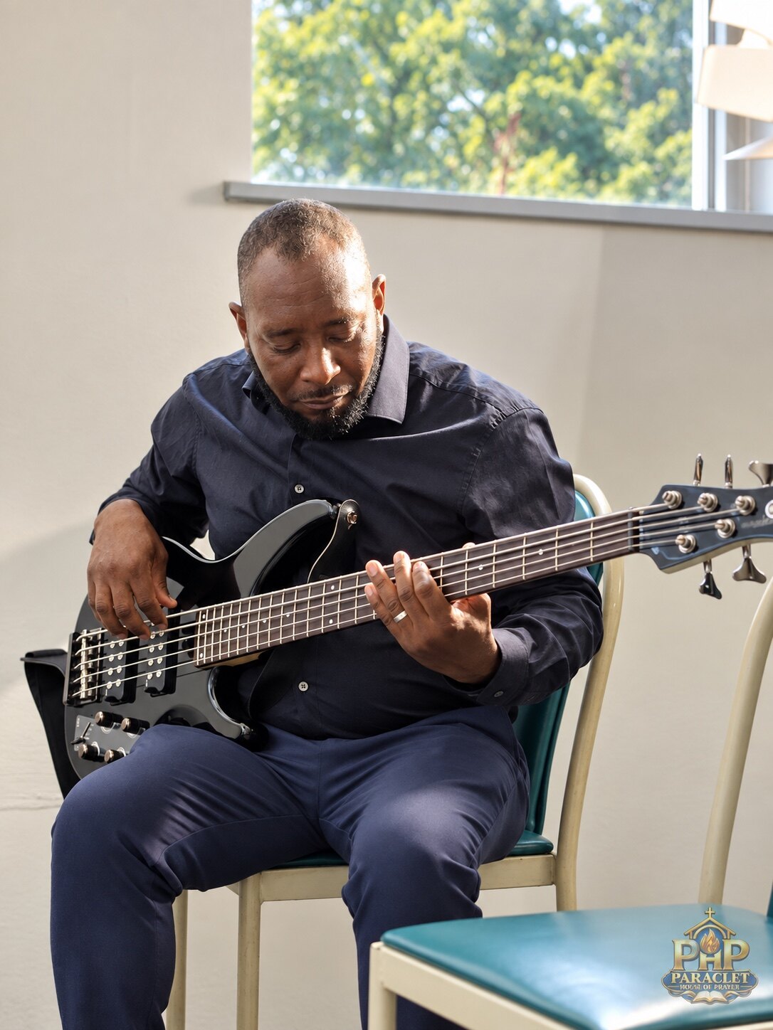 Bass guitarist serving during Sunday worship